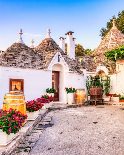 Famous,Trulli,Houses,During,A,Sunny,Day,With,Bright,Blue