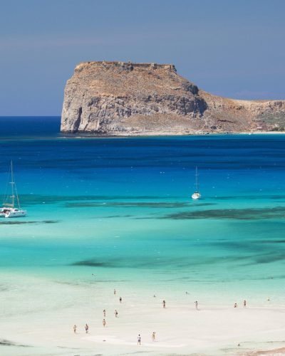 View over Balos Beach and the shallow turquoise waters of the Balos Lagoon to Gramvousa Bay and the island of Imeri Gramvousa, near Kissamos (aka Kastelli), Hania (aka Chania), Crete, Greece, Europe